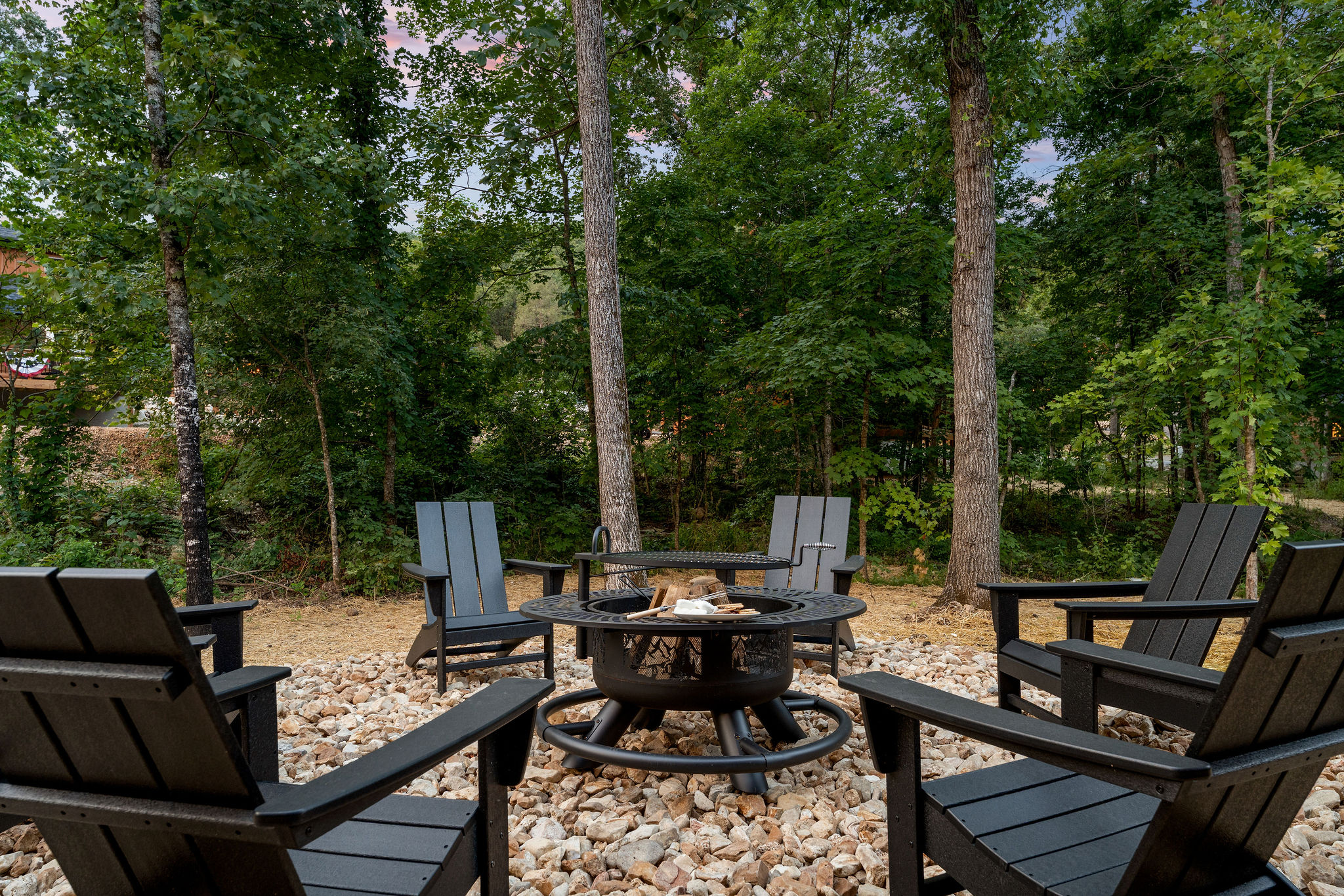 Fire pit seating area in the trees