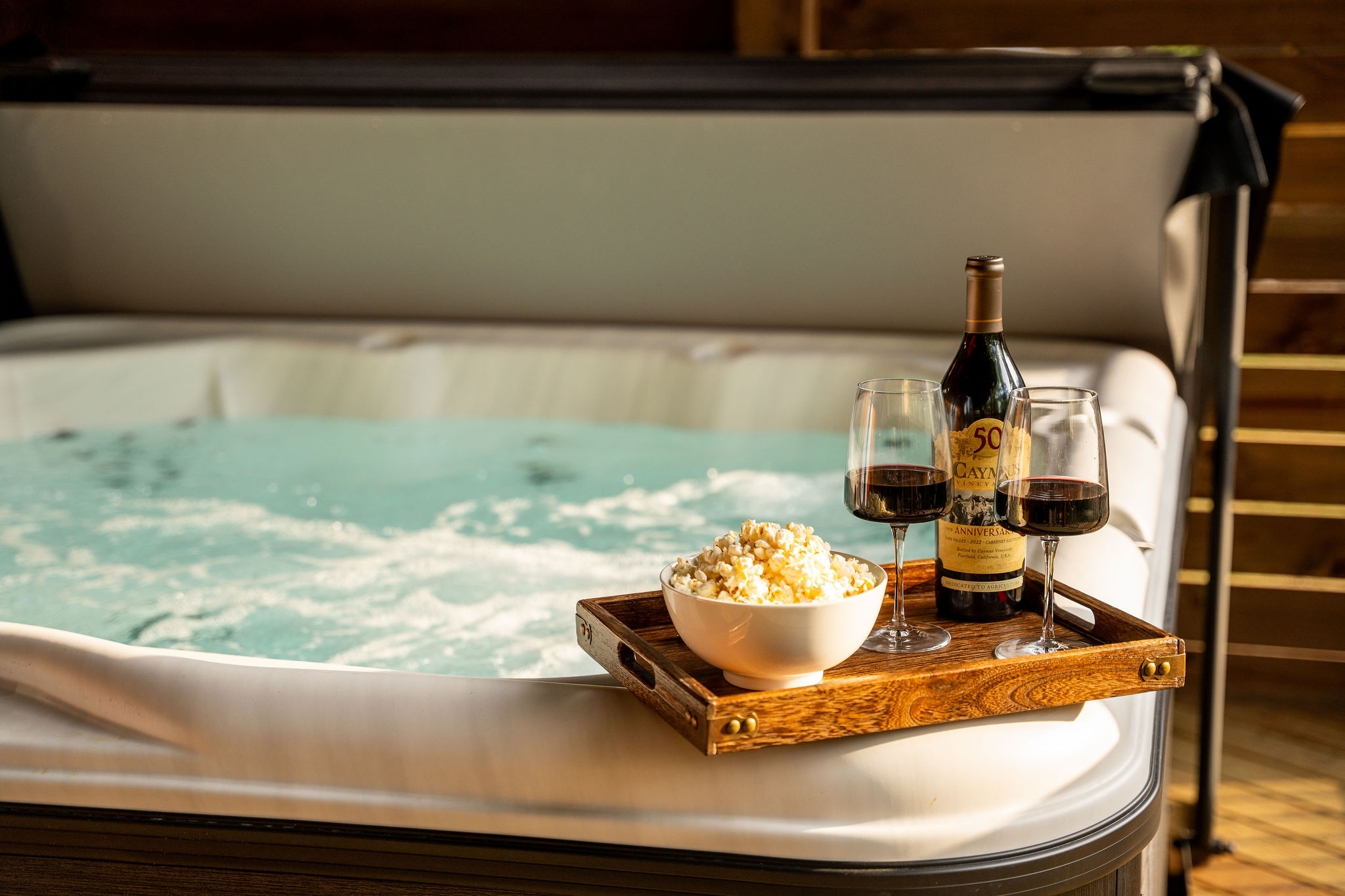 Private hot tub with wine and popcorn